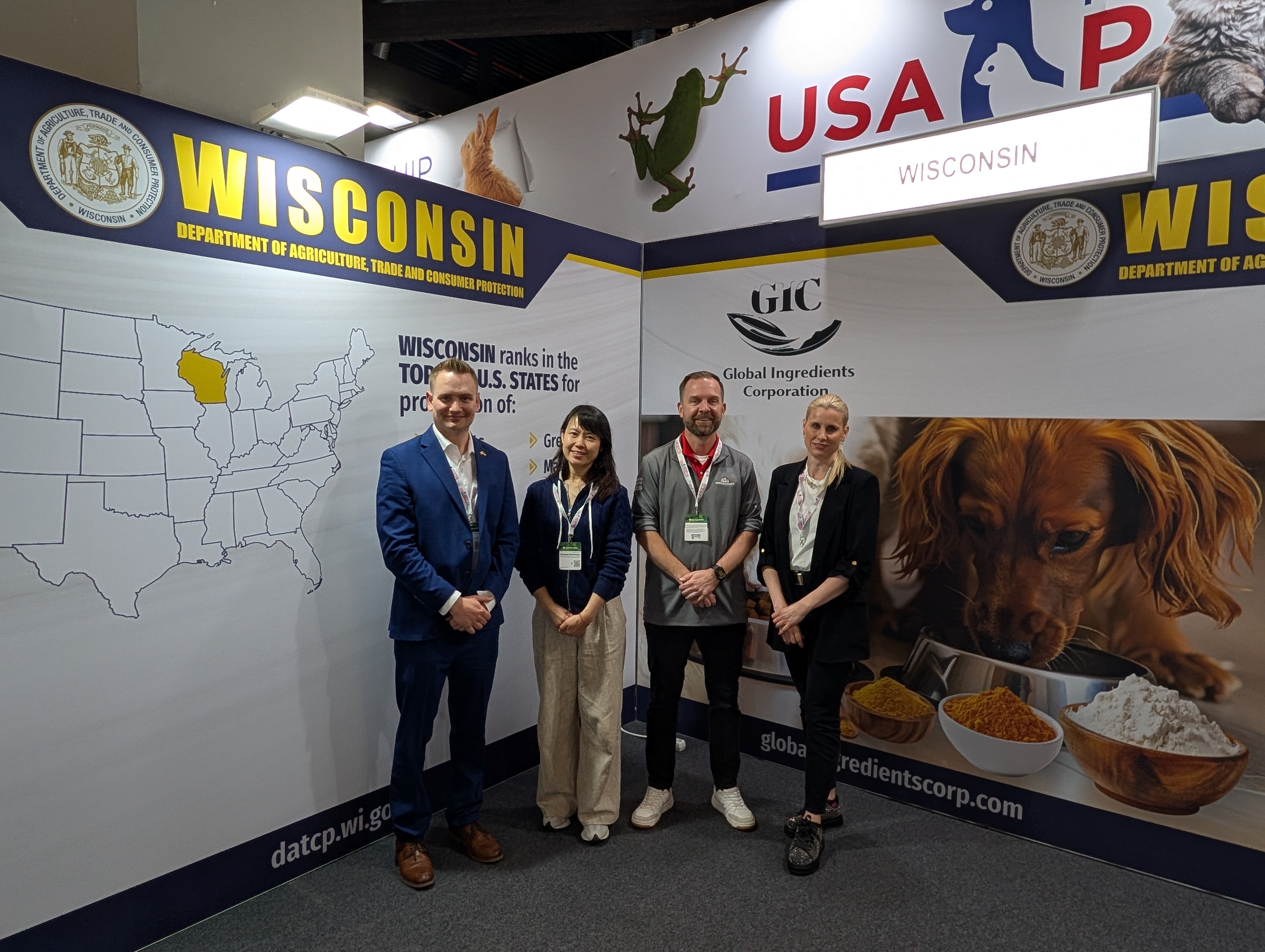 DATCP staff from the International Agribusiness Center and reps stand in Wisconsin booth at the show