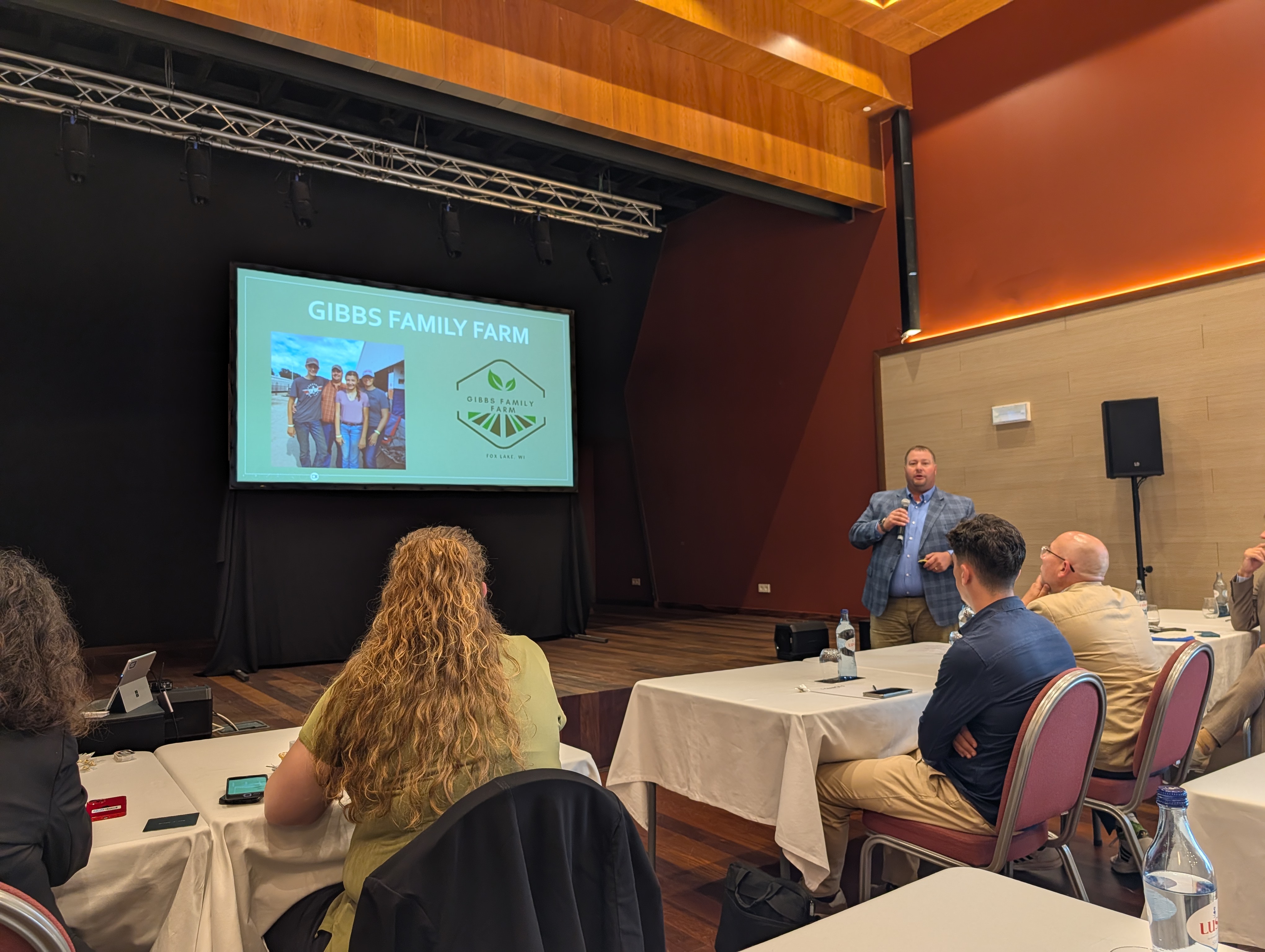 Mission participants watch a presentation on the Gibbs Family Farm.